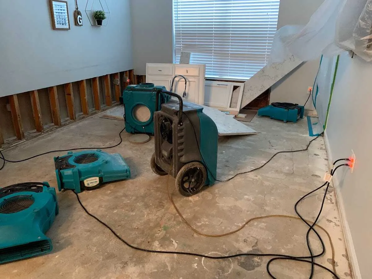 Dehumidifier in flood-cut room for Water Damage Restoration in Bright